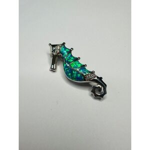 sterling silver seahorse pendant with a blue opal inlay and cubic Z